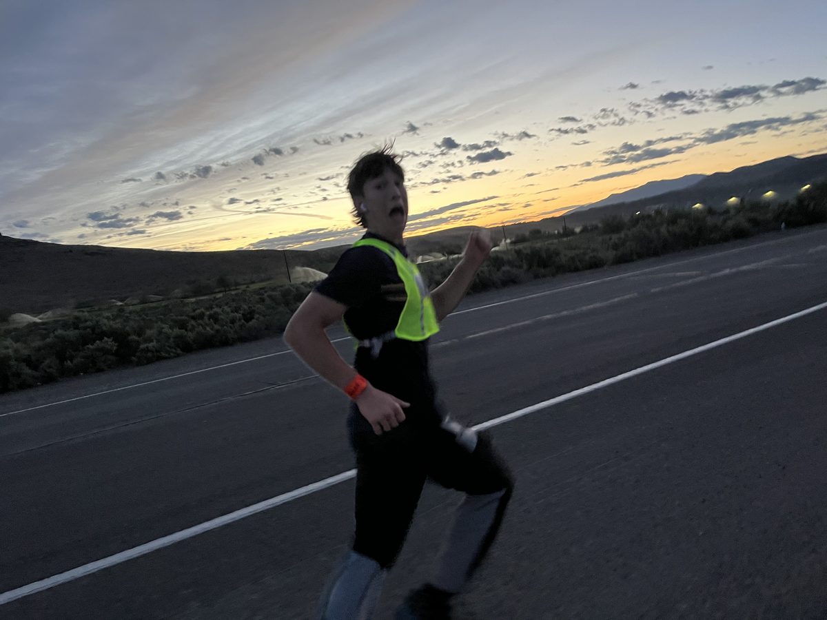 Carter running at sunset in a reflective vest